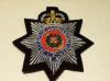Corps of Commissionaires QC blazer badge