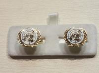 UN white enamelled cufflinks